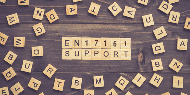 Scrabble letters forming words "EN17161" and "SUPPORT"